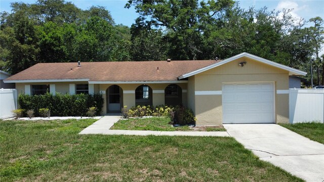 114 N Alderwood St, Winter Springs, FL 32708 - ranch-style house featuring driveway, an attached garage, and stucco siding