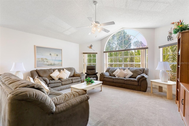2438 Sweetwater Club Cir Unit 50, Kissimmee, FL 34746 - carpeted living area with vaulted ceiling, ceiling fan, and a textured ceiling