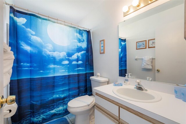 2438 Sweetwater Club Cir Unit 50, Kissimmee, FL 34746 - bathroom with toilet, vanity, a shower with shower curtain, and tile patterned flooring