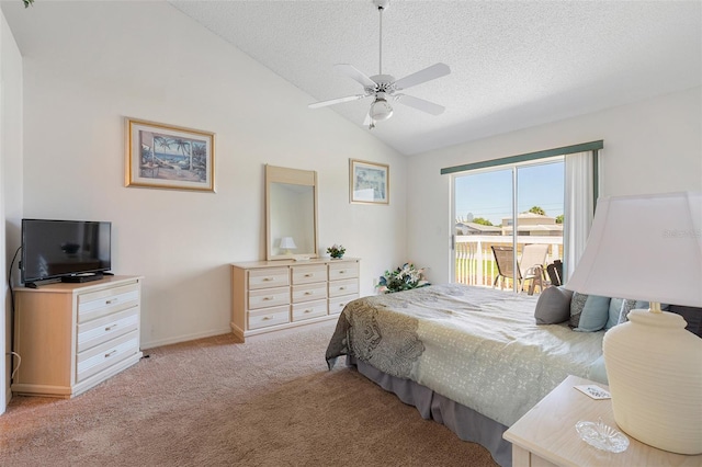 2438 Sweetwater Club Cir Unit 50, Kissimmee, FL 34746 - bedroom with access to outside, a textured ceiling, vaulted ceiling, light colored carpet, and baseboards