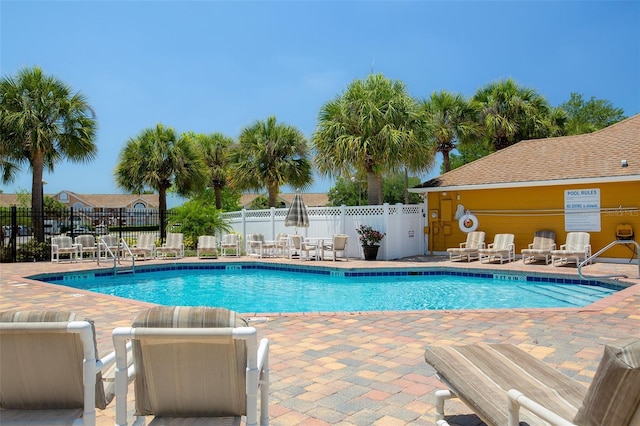 2438 Sweetwater Club Cir Unit 50, Kissimmee, FL 34746 - community pool featuring a patio area and fence