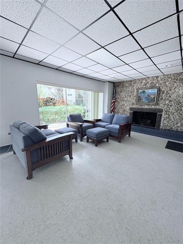 870 Virginia St Unit 108, Dunedin, FL 34698 - living area featuring a drop ceiling and a fireplace