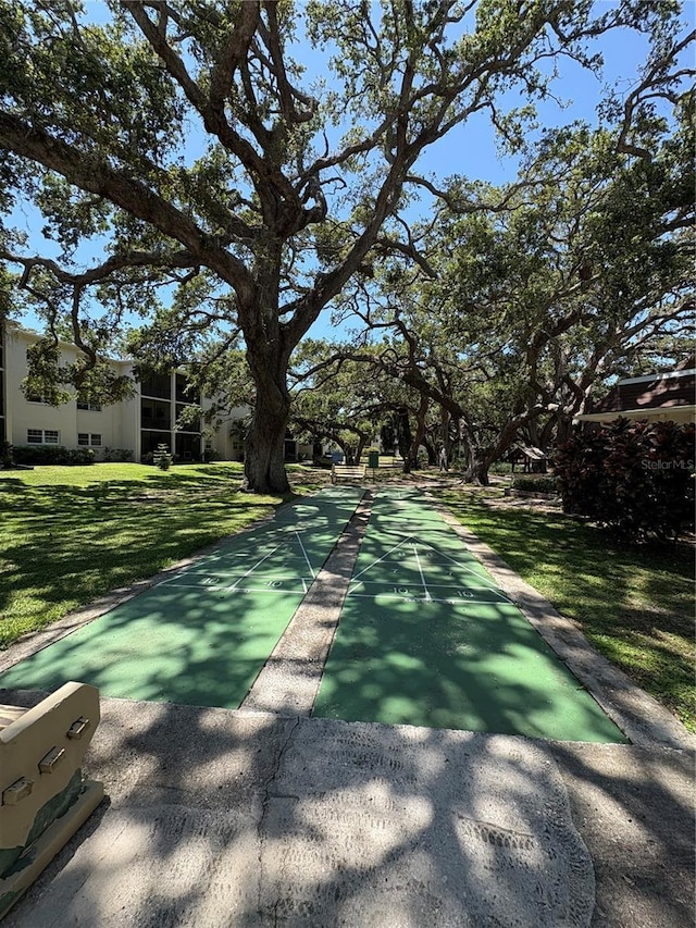 870 Virginia St Unit 108, Dunedin, FL 34698 - view of community with shuffleboard and a lawn