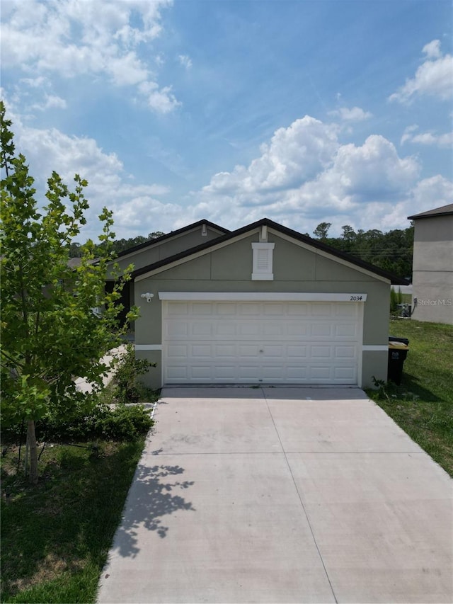 2034 Old Pasture Ln, Lakeland, FL 33801 - single story home with stucco siding and driveway