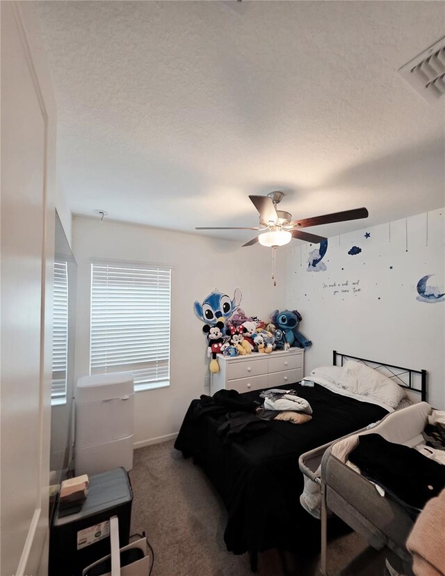 2034 Old Pasture Ln, Lakeland, FL 33801 - bedroom featuring carpet, a ceiling fan, and a textured ceiling