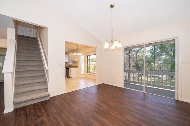120 W Minnehaha Ave, Clermont, FL 34711 - unfurnished living room featuring a chandelier, stairway, wood finished floors, vaulted ceiling, and baseboards