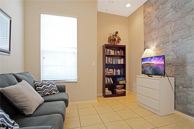 426 Prestwick Dr, Davenport, FL 33897 - living area featuring light tile patterned floors, healthy amount of natural light, baseboards, recessed lighting, and an accent wall