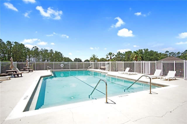 426 Prestwick Dr, Davenport, FL 33897 - community pool featuring a patio area