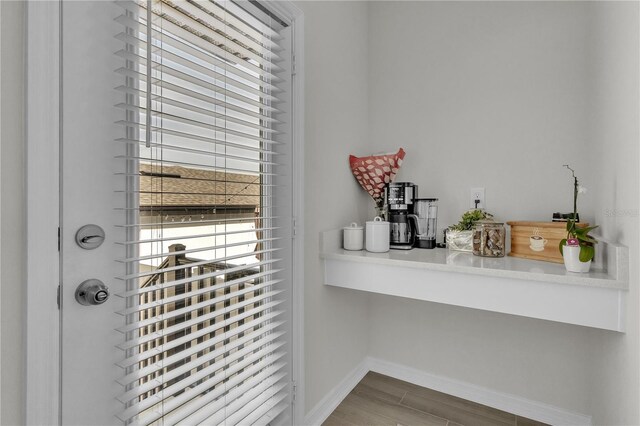 12190 Plumpton Dr, Winter Garden, FL 34787 - detailed view of baseboards and wood finished floors