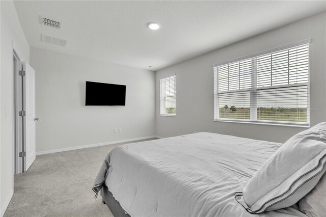 12190 Plumpton Dr, Winter Garden, FL 34787 - carpeted bedroom featuring baseboards