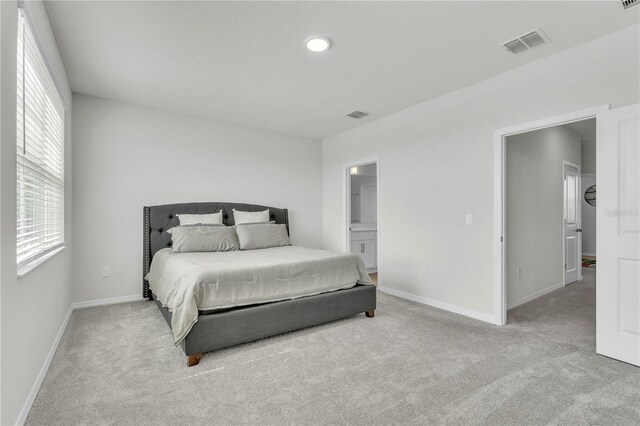 12190 Plumpton Dr, Winter Garden, FL 34787 - bedroom featuring carpet flooring, baseboards, and ensuite bath