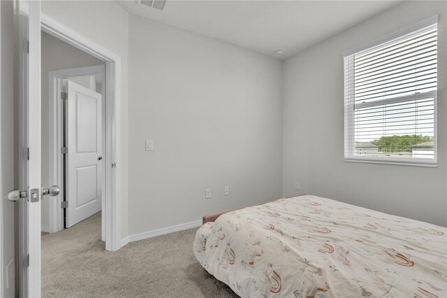 12190 Plumpton Dr, Winter Garden, FL 34787 - bedroom featuring light colored carpet and baseboards