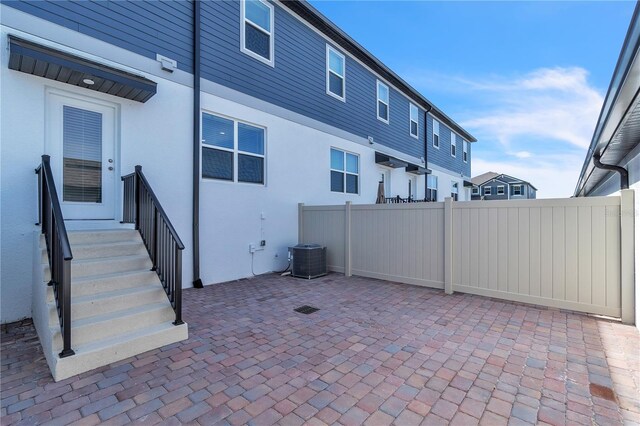 12190 Plumpton Dr, Winter Garden, FL 34787 - view of patio / terrace with central air condition unit