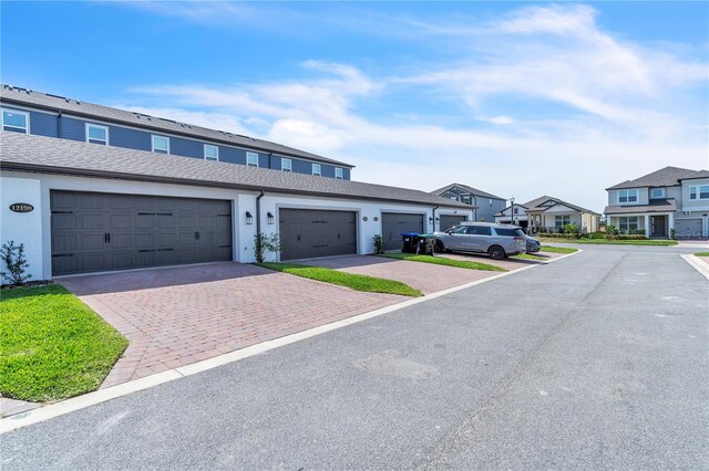 12190 Plumpton Dr, Winter Garden, FL 34787 - townhome / multi-family property with a residential view and stucco siding