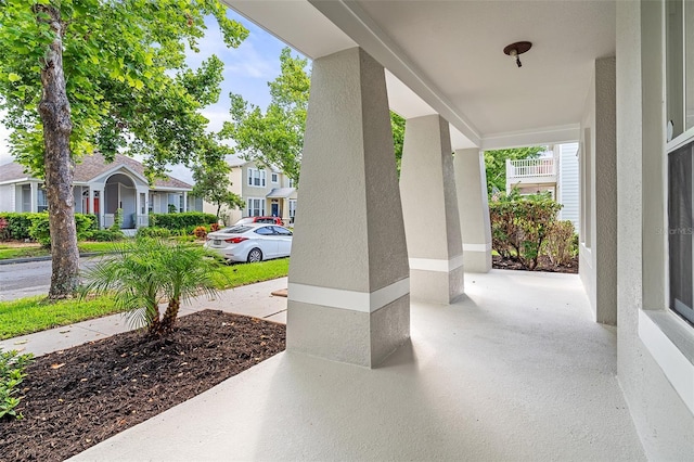 7013 Beargrass Rd, Harmony, FL 34773 - covered porch with a residential view