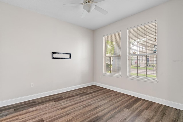 7013 Beargrass Rd, Harmony, FL 34773 - empty room featuring dark wood-style flooring and ceiling fan