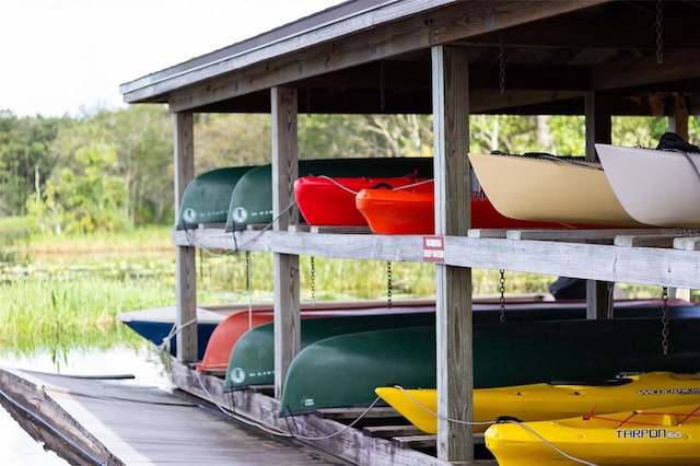 7013 Beargrass Rd, Harmony, FL 34773 - dock area featuring boat lift