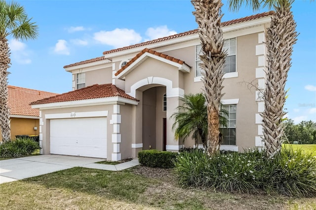 321 Rosso Dr, Davenport, FL 33837 - mediterranean / spanish home with stucco siding, a tiled roof, driveway, and a garage