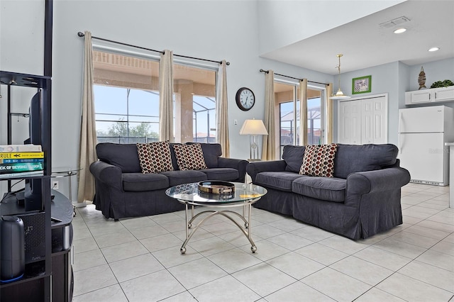 321 Rosso Dr, Davenport, FL 33837 - living room with plenty of natural light and light tile patterned flooring