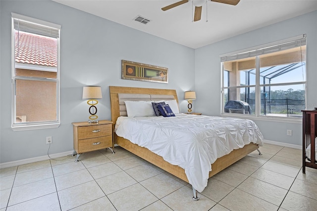 321 Rosso Dr, Davenport, FL 33837 - bedroom featuring baseboards, light tile patterned floors, and ceiling fan