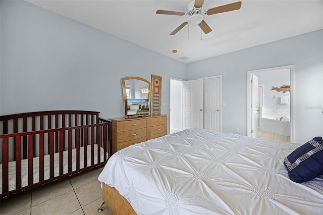 321 Rosso Dr, Davenport, FL 33837 - bedroom featuring light tile patterned floors, ceiling fan, and connected bathroom