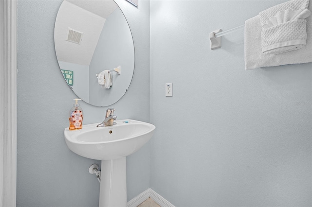 321 Rosso Dr, Davenport, FL 33837 - bathroom featuring baseboards