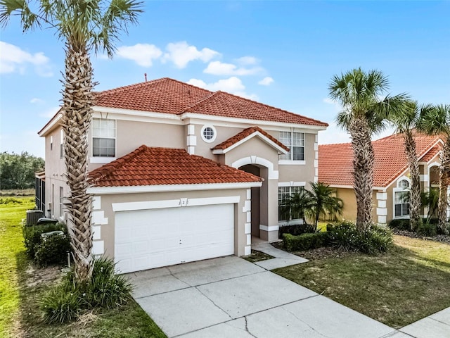 321 Rosso Dr, Davenport, FL 33837 - mediterranean / spanish home featuring stucco siding, driveway, a garage, and a tiled roof