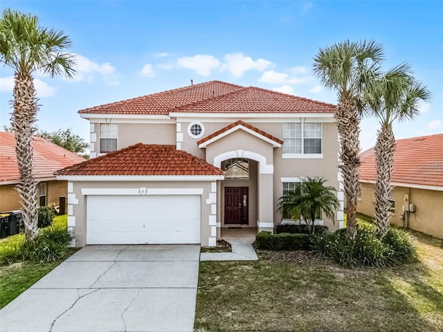 321 Rosso Dr, Davenport, FL 33837 - mediterranean / spanish-style home featuring a garage, stucco siding, a tile roof, and concrete driveway