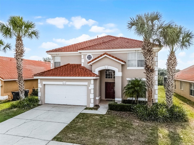 321 Rosso Dr, Davenport, FL 33837 - mediterranean / spanish-style home with a garage, a tiled roof, stucco siding, and driveway