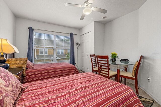 2620 Lodi Cir Unit 103, Kissimmee, FL 34746 - bedroom featuring carpet flooring, baseboards, and ceiling fan