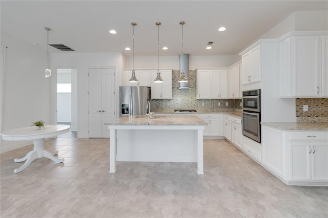 5009 E Fountainwood Dr, Saint Cloud, FL 34772 - kitchen with stainless steel appliances, ventilation hood, a sink, decorative backsplash, and light stone counters