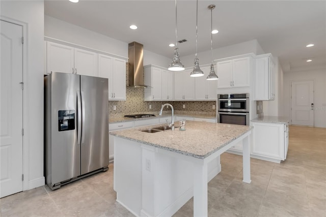 5009 E Fountainwood Dr, Saint Cloud, FL 34772 - kitchen with stainless steel appliances, wall chimney exhaust hood, a sink, white cabinetry, and recessed lighting