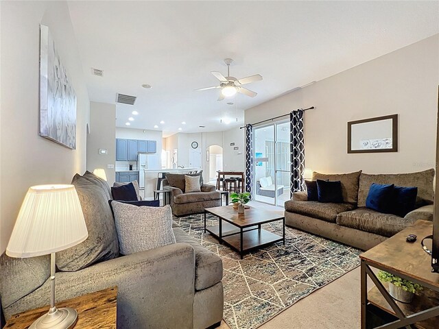 518 Brighton Dr, Davenport, FL 33897 - living room featuring ceiling fan and arched walkways