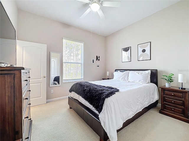 518 Brighton Dr, Davenport, FL 33897 - bedroom with light carpet, baseboards, and a ceiling fan