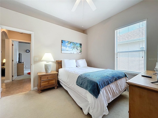 518 Brighton Dr, Davenport, FL 33897 - bedroom with light carpet, ceiling fan, and light tile patterned flooring