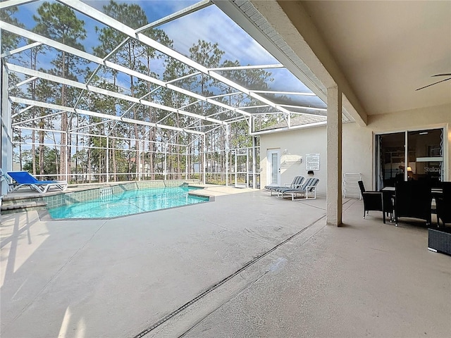 518 Brighton Dr, Davenport, FL 33897 - swimming pool with a patio area, ceiling fan, and glass enclosure