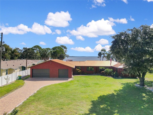 955 Mansfield Rd, Tavares, FL 32778 - ranch-style house featuring a detached garage and an outbuilding