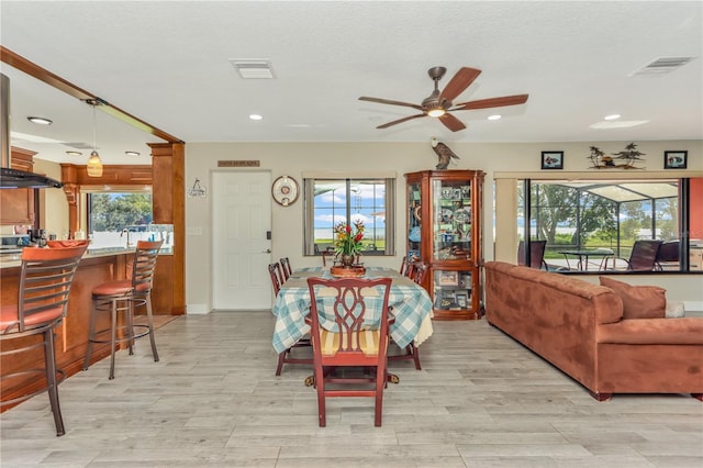 955 Mansfield Rd, Tavares, FL 32778 - dining space featuring ceiling fan, recessed lighting, healthy amount of natural light, light wood-style flooring, and baseboards