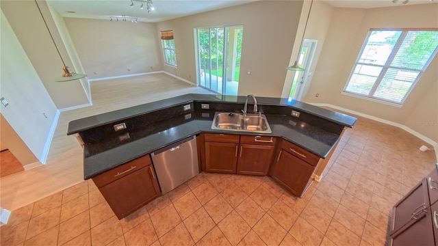 6957 Northwich Dr, Windermere, FL 34786 - kitchen featuring a sink, open floor plan, stainless steel dishwasher, and dark countertops