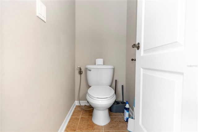 6957 Northwich Dr, Windermere, FL 34786 - bathroom featuring toilet, tile patterned flooring, and baseboards