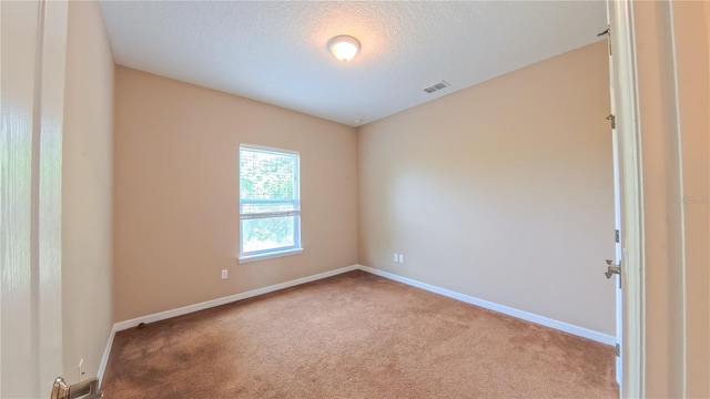 6957 Northwich Dr, Windermere, FL 34786 - unfurnished room with carpet floors, baseboards, and a textured ceiling