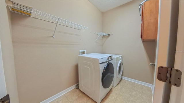 6957 Northwich Dr, Windermere, FL 34786 - laundry room with washer and clothes dryer, cabinet space, and baseboards