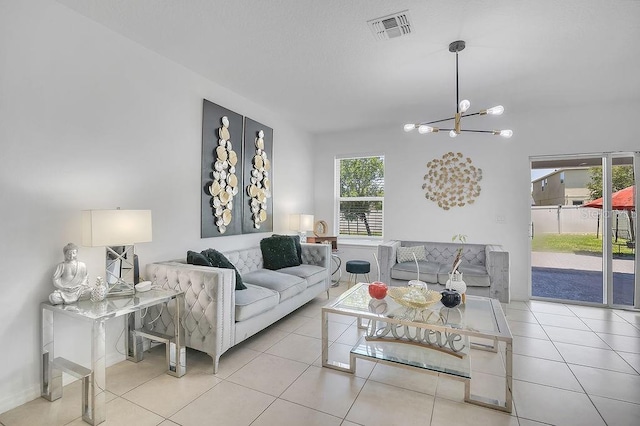3400 Mt Vernon Way, Kissimmee, FL 34741 - tiled living area with a chandelier