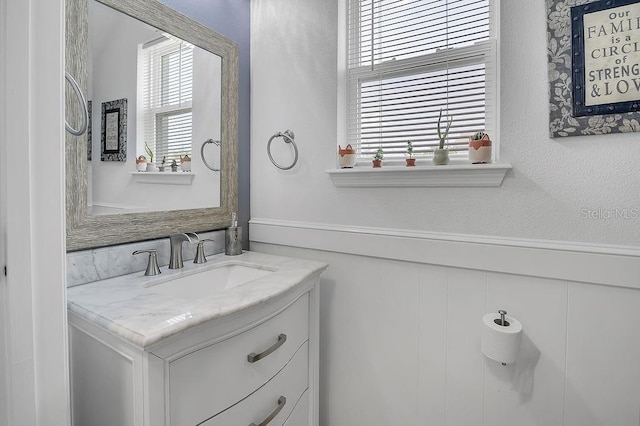 3400 Mt Vernon Way, Kissimmee, FL 34741 - bathroom featuring vanity and wainscoting
