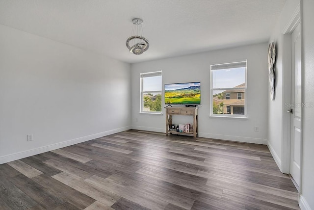 3400 Mt Vernon Way, Kissimmee, FL 34741 - empty room featuring wood finished floors, baseboards, and a chandelier