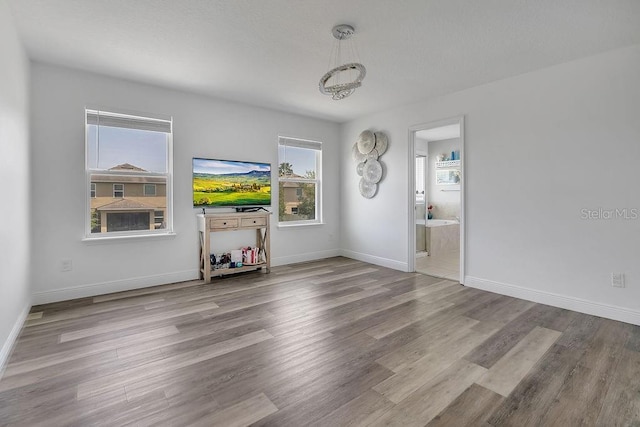 3400 Mt Vernon Way, Kissimmee, FL 34741 - unfurnished living room with wood finished floors and baseboards