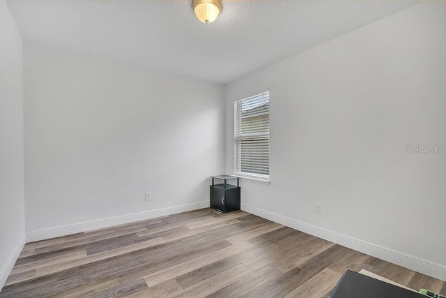 3400 Mt Vernon Way, Kissimmee, FL 34741 - empty room featuring wood finished floors and baseboards