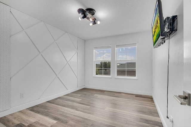 3400 Mt Vernon Way, Kissimmee, FL 34741 - unfurnished room featuring wood finished floors and baseboards