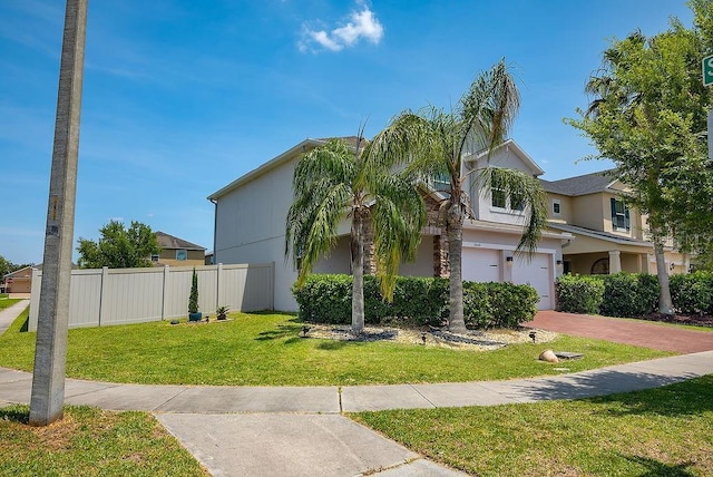 3400 Mt Vernon Way, Kissimmee, FL 34741 - view of front of home with a garage, decorative driveway, and stucco siding
