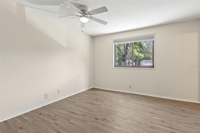 411 Sheoah Blvd Unit 33, Winter Springs, FL 32708 - spare room featuring wood finished floors, baseboards, and ceiling fan